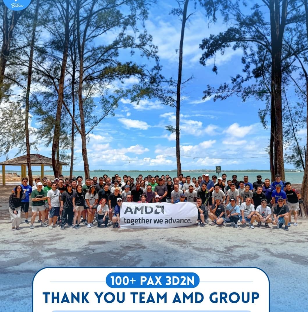 A company group of over a hundred people on a Batam beach during a private trip